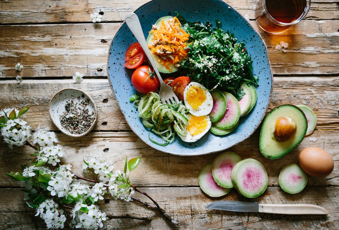 Fresh produce and herbs arranged for cooking preparation